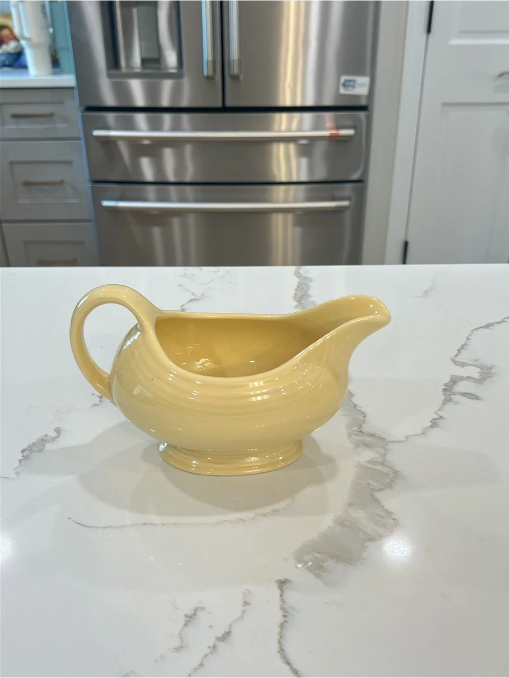 Vintage Fiesta Ware light yellow “sunflower” gravy boat EUC
